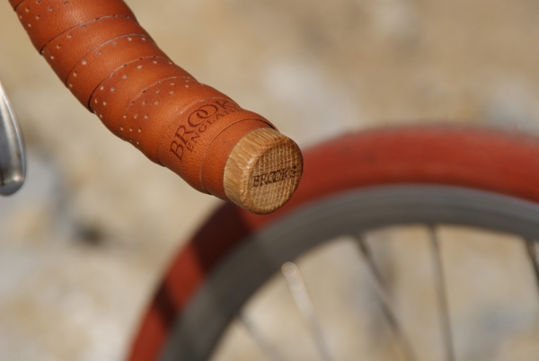 Bar tape end cap with Brooks logo